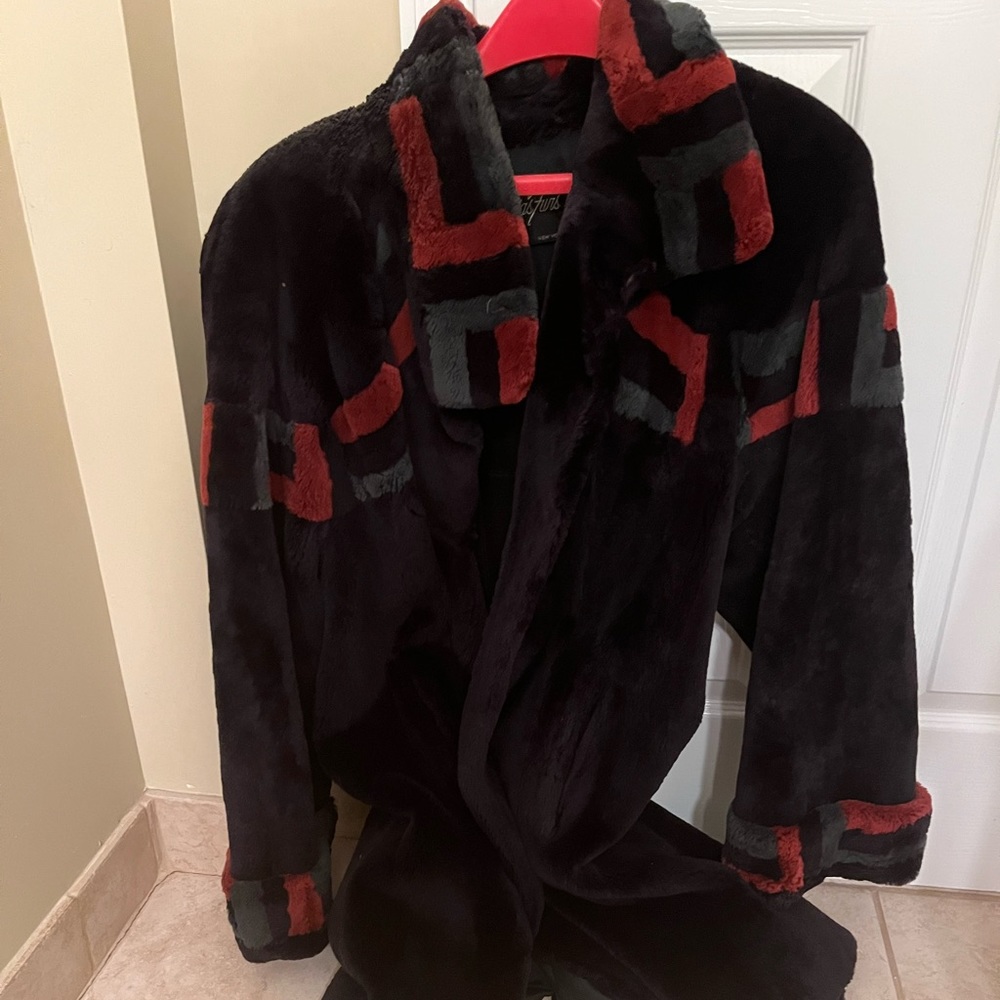 Real fur coat. Mainly Purple with rust/green modern colored pattern. Knee length